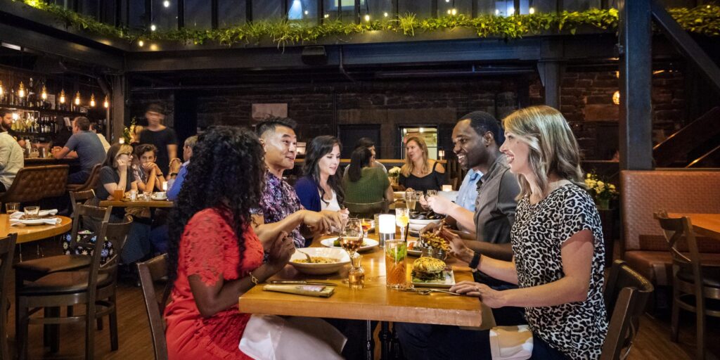 Restaurant patrons enjoy evening food and drink
